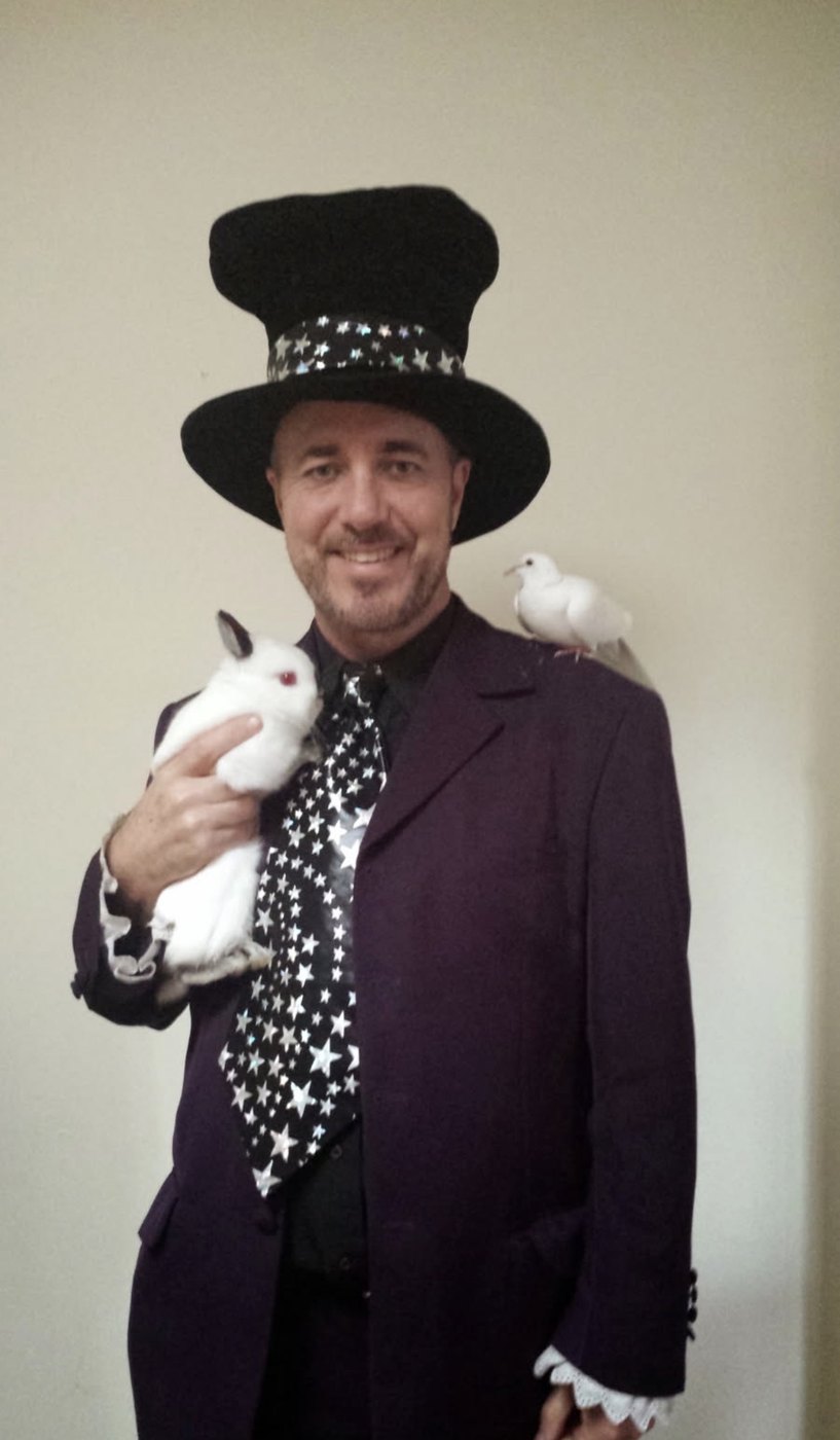 Wizard magic show with doves and rabbit