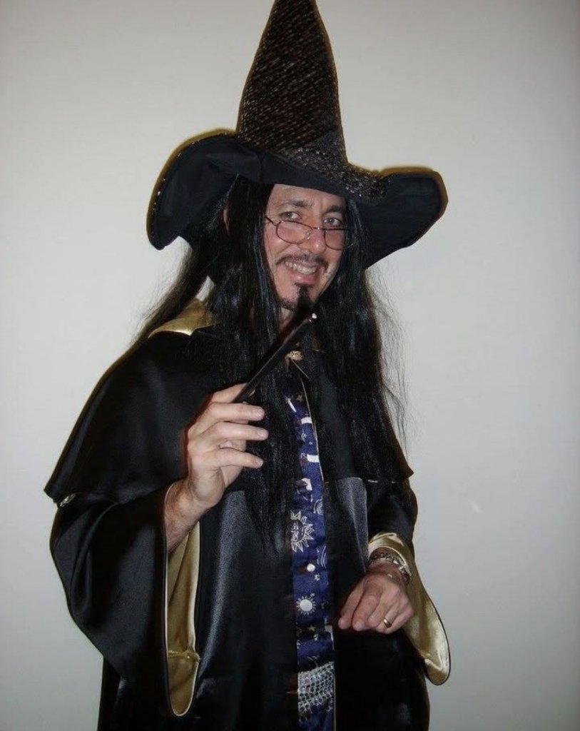 Wizard in black hat with wand